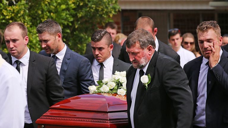 The brother of Phillip Hughes, Jason Hughes (L) and father Gregory Hughes (2nd Right) carry the coffin with Michael Clarke (2nd left) and Aaron Finch (R) 