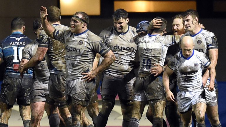 Bath's players celebrate after scoring a try during the European Rugby Champions Cup Montpellier v Bath game