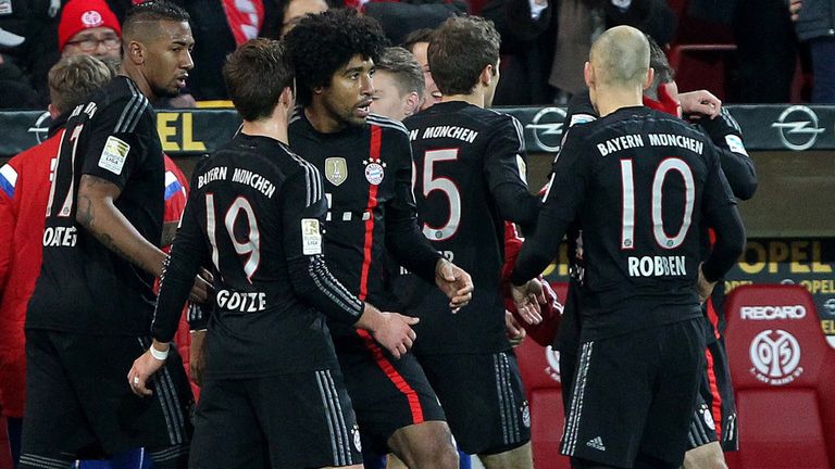 Munich's players celebrate after Bayern Munich's midfielder Bastian Schweinsteiger scored the 1-1 during 
