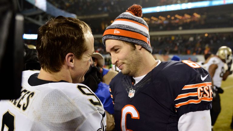 Drew Brees (left) commiserates with Jay Cutler of the Chicago Bears