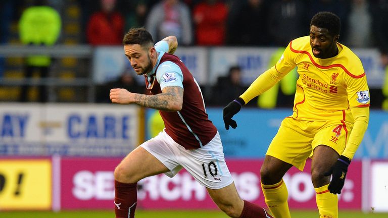 Danny Ings of Burnley goes past Kolo Toure of Liverpool