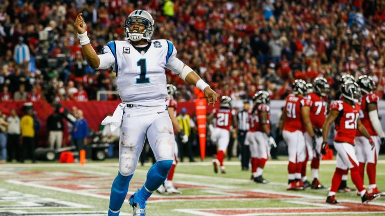 Cam Newton celebrates his touchdown in the first half against the Atlanta Falcons