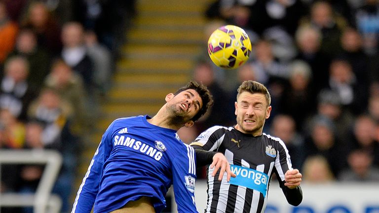 Chelsea's Diego Costa (left) and Newcastle United's Paul Dummett in action