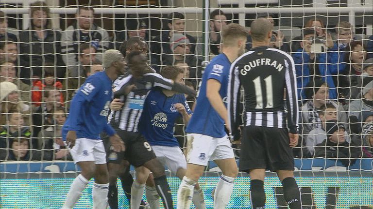 Papiss Cisse elbows Seamus Coleman inside the penalty area