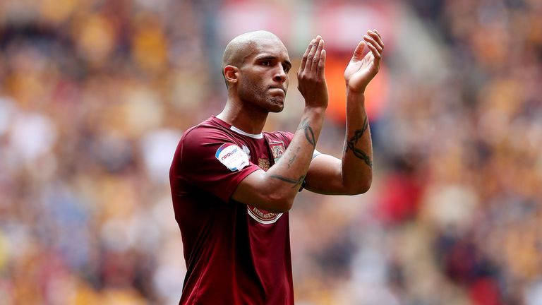 Clarke Carlisle looks dejected after defeat during the npower League Two Play Off Final