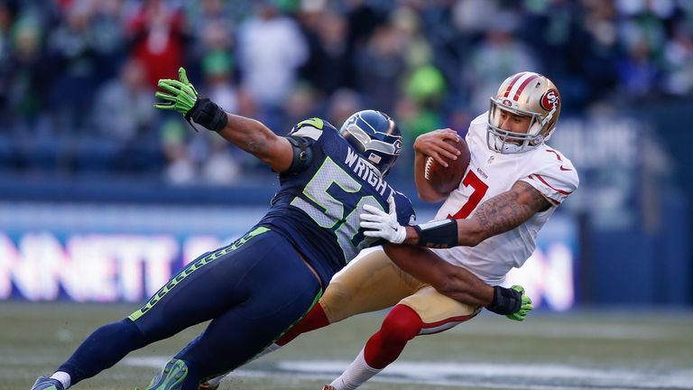 SEATTLE, WA - DECEMBER 14:  Quarterback Colin Kaepernick #7 of the San Francisco 49ers is sacked by outside linebacker K.J. Wright #50 of the Seattle Seaha