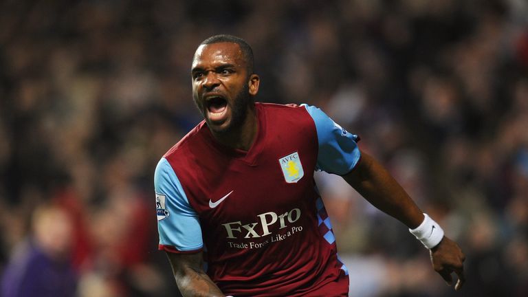 Darren Bent of Aston Villa celebrates after scoring the opening goal on his debut for the club against Manchester City in 2011