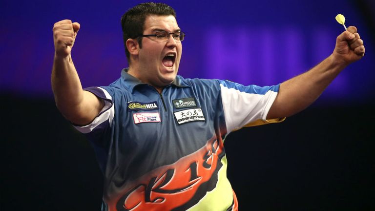 Cristo Reyes celebrates winning his second round match against Kevin Painter at the PDC World Darts Championships