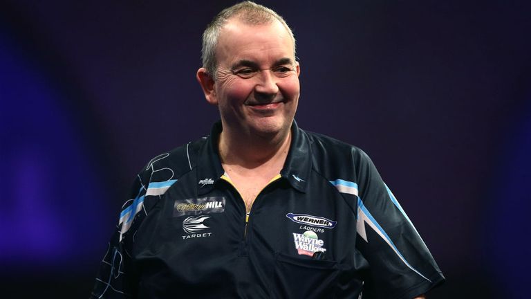 Phil Taylor walks off the stage after his second round match against Mark Webster at Alexandra Palace