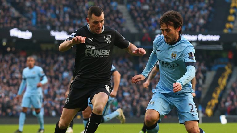 Dean Marney closes down David Silva 