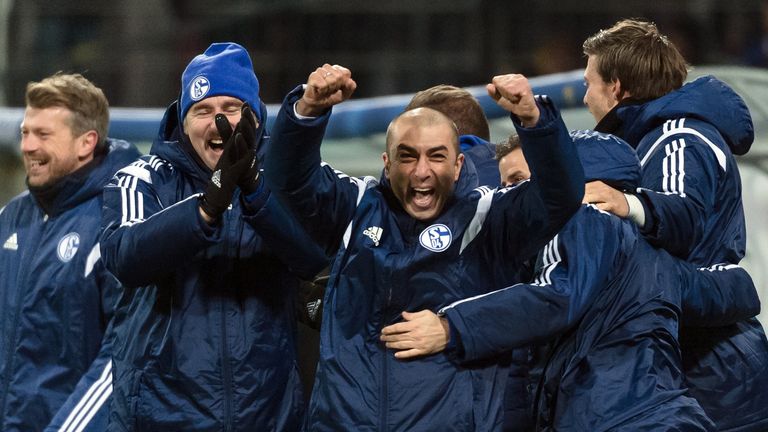 Schalke's head coach Roberto Di Matteo (C) celebrates with his team
