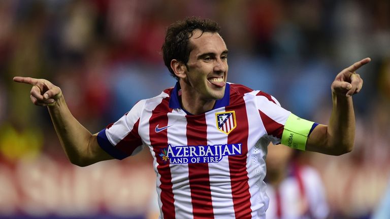 Atletico Madrid's Uruguayan defender Diego Godin celebrates after scoring their fourth goal during the UEFA Champions League match v Malmo