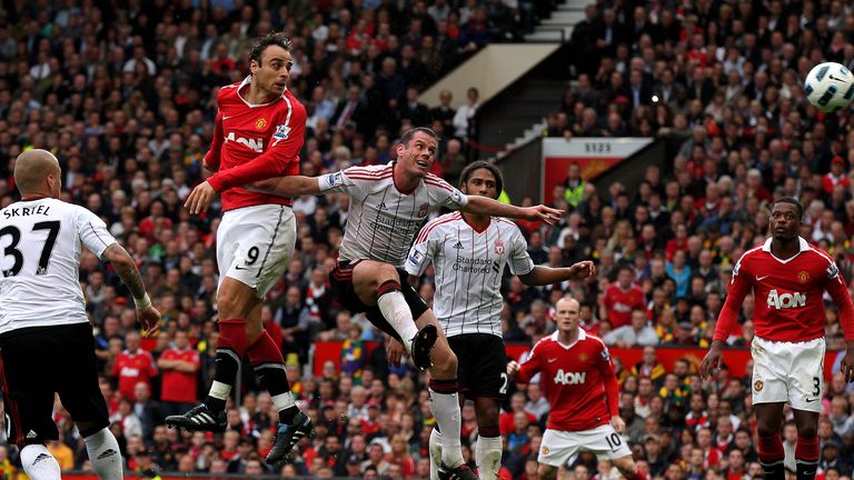 Dimitar Berbatov of Manchester United scores his team's third goal to complete his hat-trick during the Premier League game against Liverpool in 2010