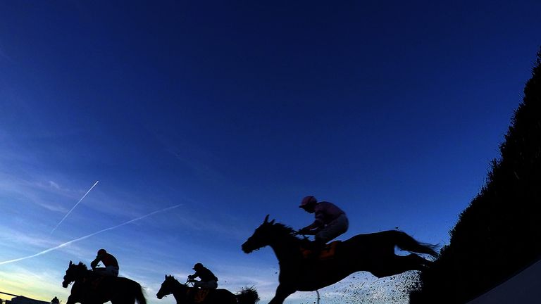Dodging Bullets (left) ridden by Sam Twiston-Davies beats Somersby (centre) ridden by AP McCoy to win the 888sport Tingle Creek Chase during Tingle Creek D