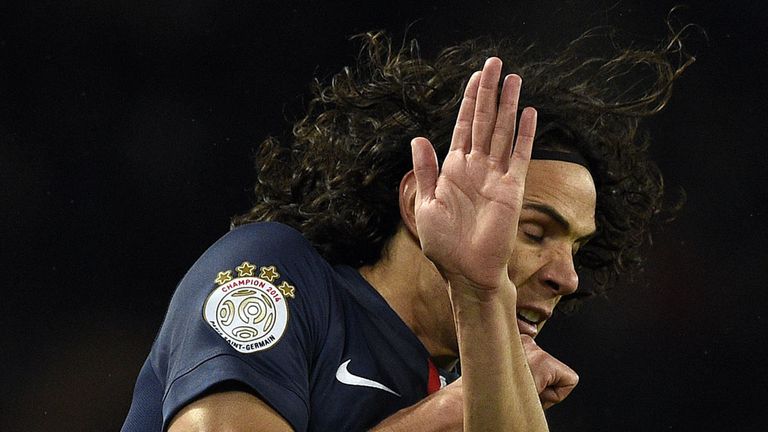 Paris Saint-Germain's Uruguayan forward Edinson Cavani protects his face during a stage of the French L1 football 