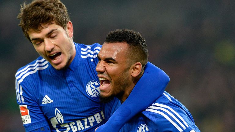 STUTTGART, GERMANY - DECEMBER 06:  Eric Maxim Choupo-Moting of Schalke (R) celebrates his team's third 