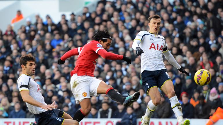 Radamel Falcao García of Manchester United takes a shot on goal as Federico Fazio (L) of Spurs and Vlad Chiriches (R) of S