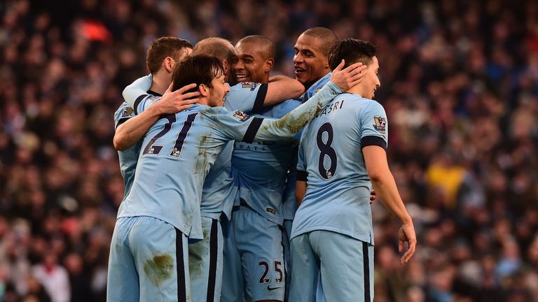 City's Fernandinho (C) celebrates scoring their second goal with teammates during their match against Burnley at the Etihad Stadium