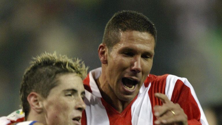 Atletico Madrid's Fernando Torres celebrates with team-mate Diego Simeone after scoring a goal in January 2004