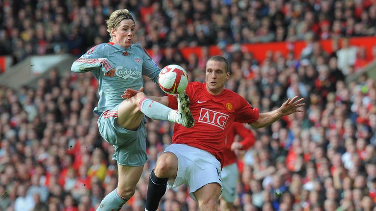 Liverpool  forward Fernando Torres beats Manchester United defender Nemanja Vidic to score the equalising goal during the Premier League game in March 2006
