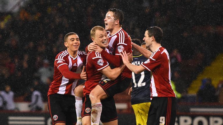 Marc McNulty of Sheffield United celebrates scoring the opening goal with team mates during the Capital One Cup clash with Southampton