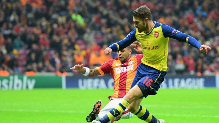 Aaron Ramsey of Arsenal (R) scores their second goal during the UEFA Champions League Group D match between Galatasaray and Arsenal