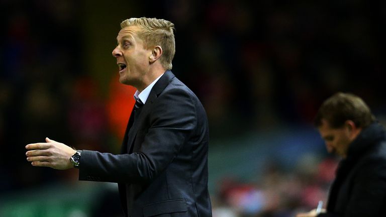 LIVERPOOL, ENGLAND - DECEMBER 29:  Manager Garry Monk of Swansea City issues instructions to his players next to Brendan Rodgers, manager of Liverpool duri