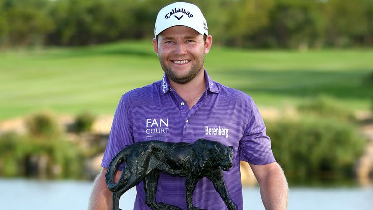 Branden Grace hold the trophy at the Alfred Dunhill Championship at Leopard Creek Country Golf Club 