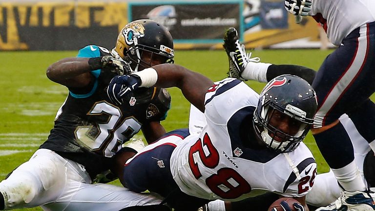 Alfred Blue crosses the Jaguars' goal line for a touchdown.