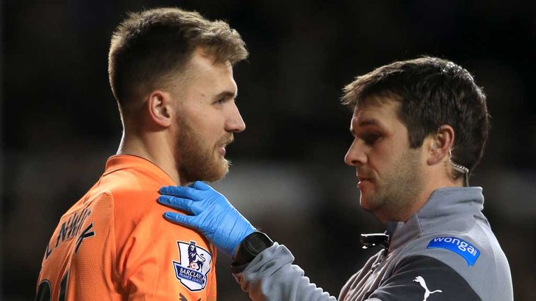 Jak Alnwick: Newcastle goalkeeper receives treatment on his shoulder injury at Tottenham