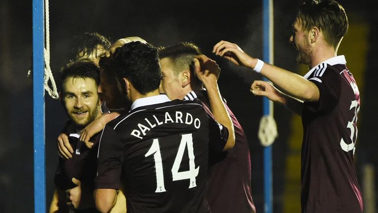 James Keatings is mobbed by his team-mates after Hearts open the scoring against Cowdenbeath at Central Park