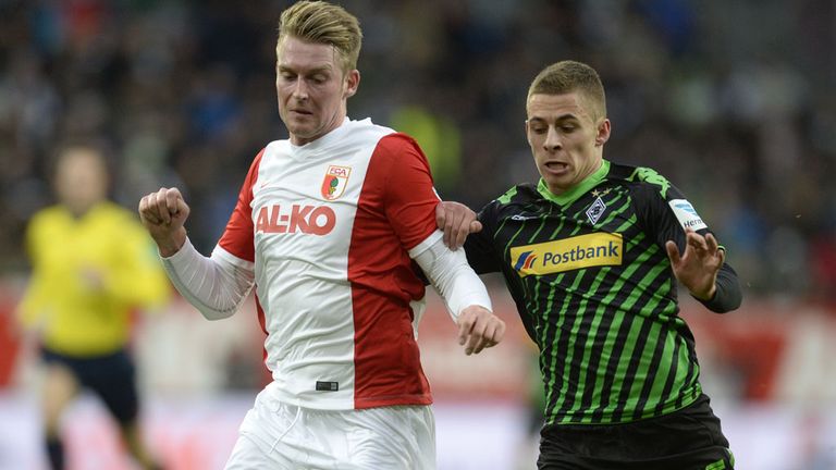 Augsburg's defender Jan-Ingwer Callsen-Bracker (L) and Moenchengladbach's Belgian midfielder Thorgan Hazard 