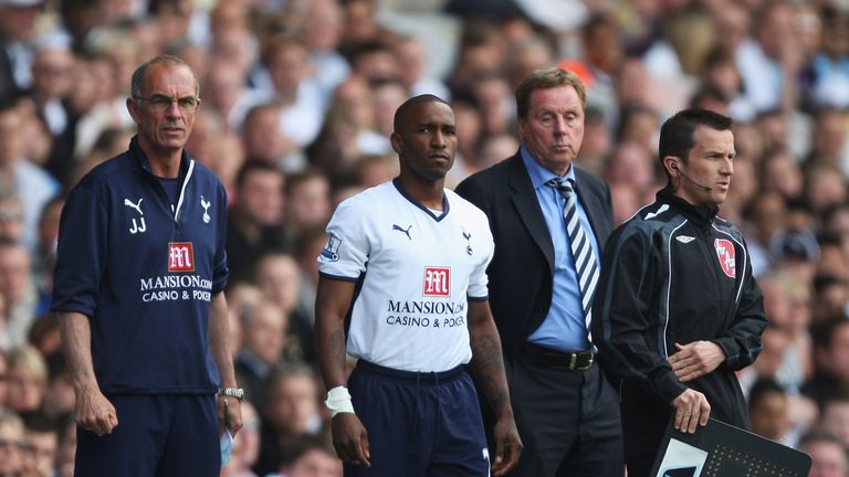 LONDON - MAY 02: Jermain Defoe of Tottenham Hotspur waits to come on with Manager Harry Redknapp and Joe Jordan (L) during the Barclays Premier League matc