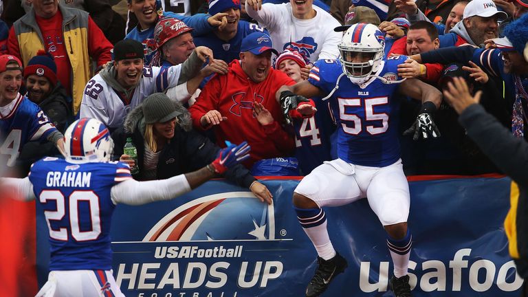 Jerry Hughes of the Buffalo Bills celebrates a touchdown against the Cleveland Browns