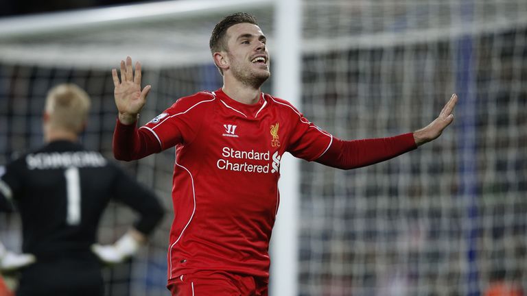 Liverpool's Jordan Henderson celebrates after making it 3-1 against Leicester