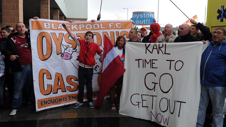 Blackpool fans hold a protest outside the ground against club chairman Karl Oyston during a Pre Season Friendly match 