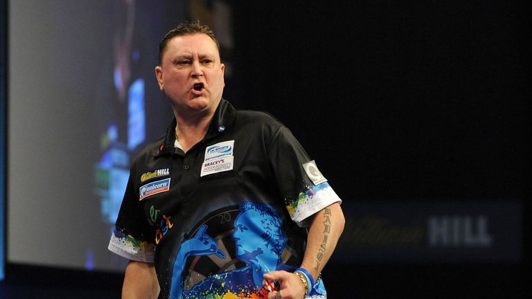 Kevin Painter celebrates winning the second set during his match against Cristo Reyes during the William Hill World Darts Championship at Alexandra Palace,