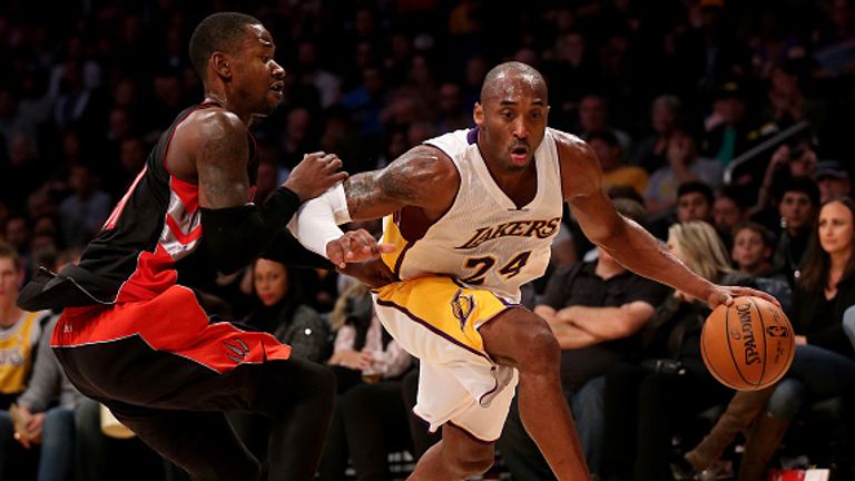 Kobe Bryant of the Los Angeles Lakers drives against Terrence Ross of the Toronto Raptors. 