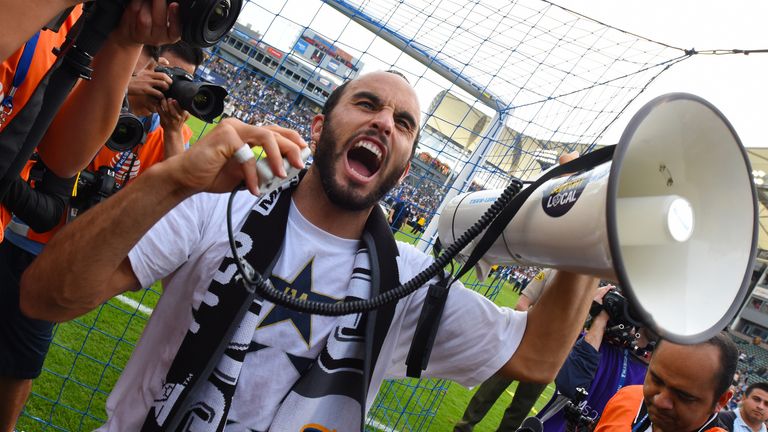 Landon Donovan of the Los Angeles Galaxy does a lap of honor to salute the fans after 2-1 win over the New England Revolution in the MLS Cup final