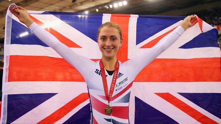 LONDON, ENGLAND - DECEMBER 07:  Laura Trott of Great Britain poses with her gold medal and a Union Jack flag after winning the Women's Omnium on day three 