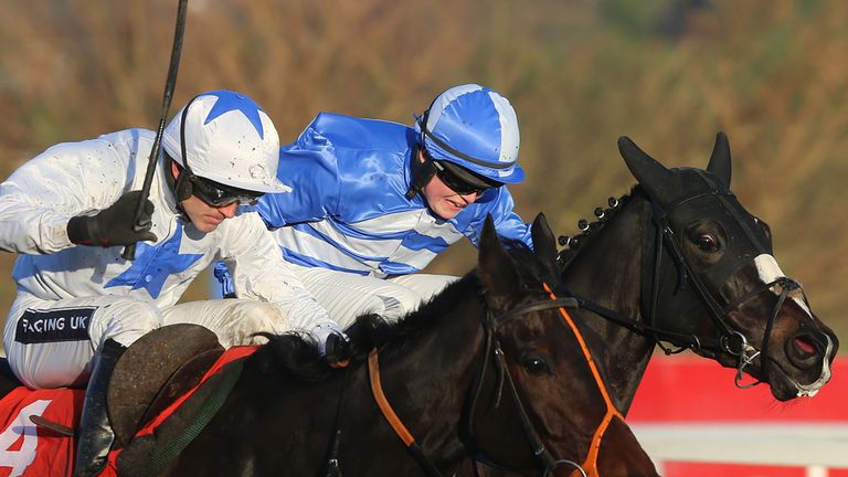 Shemshal (left), ridden by Ruby Walsh, comes with a well-timed run to land the novice handicap hurdle at Leopardstown