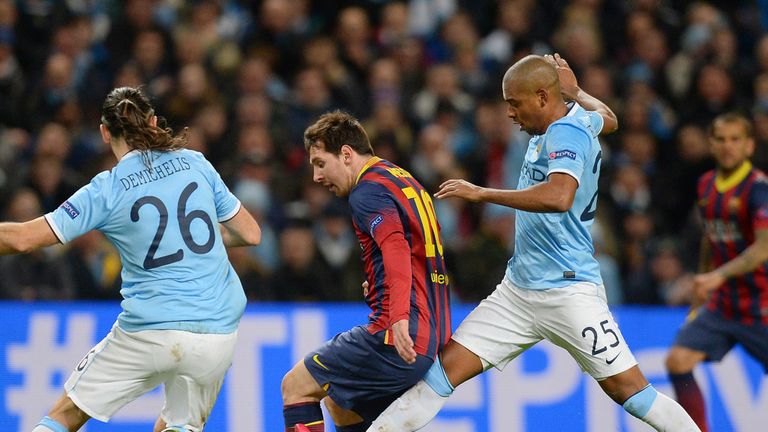 Barcelona's Lionel Messi vies for the ball against Manchester City's defender Martin Demichelis (L) and Manchester City's Brazilian midfielder Fernandinho