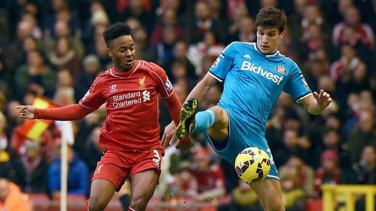 Raheem Sterling and Santiago Vergini compete for possession