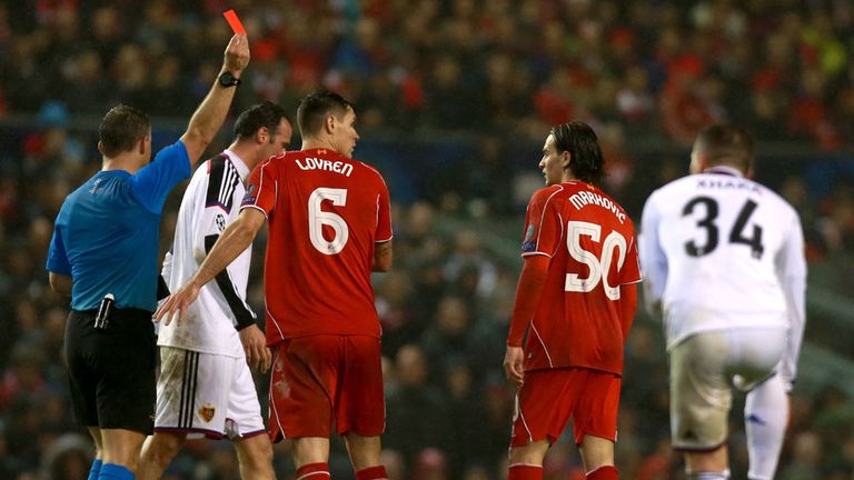 Liverpool's Lazar Markovic is shown the red card by referee Jorn Kuipers during the UEFA Champions League Group B game at Anfield, Liverpool