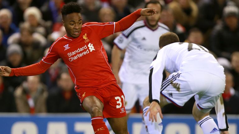 Liverpool's Raheem Sterling (left) runs at Basel's Fabian Frei (right) during the UEFA Champions League Group B game at Anfield, Liverpool