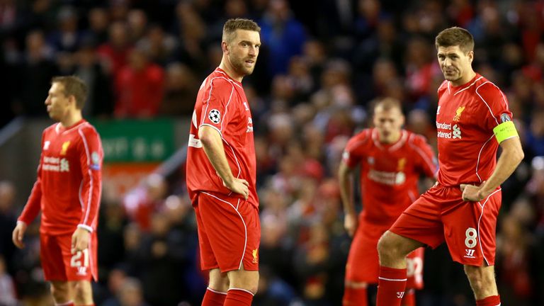 Liverpool's Steven Gerrard (right) and Rickie Lambert (left) stand dejected at the centre circle after conceding a goal