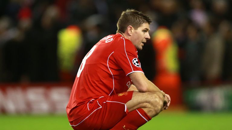 Liverpool's Steven Gerrard crouches dejected after the UEFA Champions League Group B game at Anfield, Liverpool