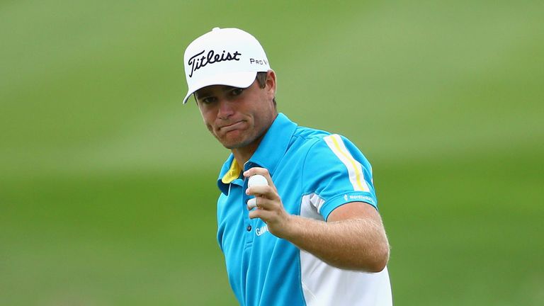  Lucas Bjerregaard of Denmark reacts to a birdie on the 18th green during the third round of the Alfred Dunhill Championship