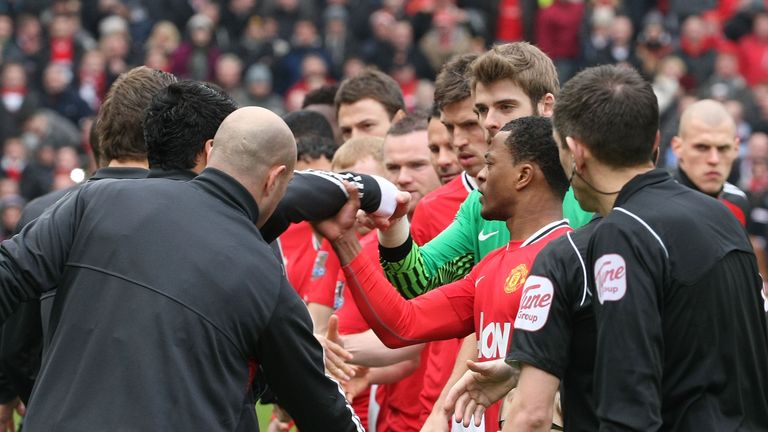 Luis Suarez refuses to shake the hand of Patrice Evra