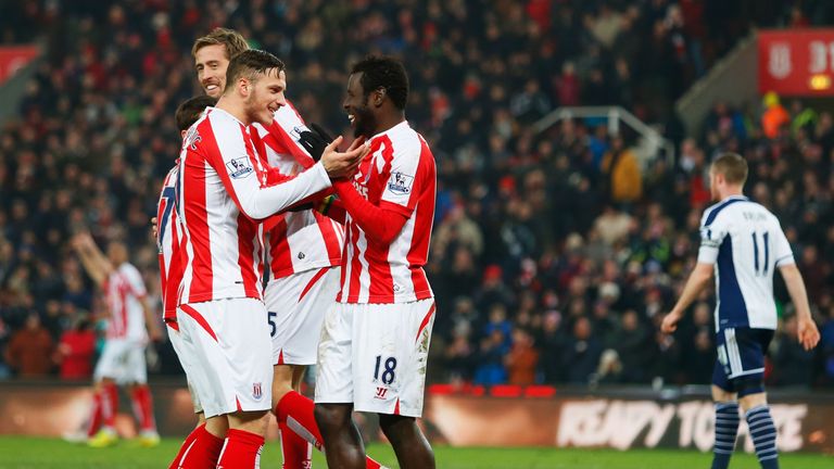 Mame Biram Diouf of Stoke City celebrates with Marko Arnautovic as he scores their first goal against West Brom
